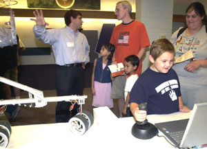 Seven-year-old Richard Edwards works the control platform the Mars rover during a demonstration of space engineering experiments in Lopata Hall. The outreach program aims at capturing students' interest in science and technology through hands-on particip