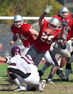 Junior defensive back Jon Kuerzi blocks a field-goal attempt by the University of Chicago during the Oct. 18 Homecoming Game at Francis Field. The Bears notched a 28-0 shutout in the University Athletic Association opener.
