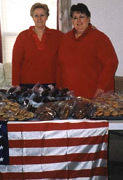 Jill Edwards (left), office supervisor in the University's administrative offices, and her sister Sue Kohn have sent 464 pounds of goods since early March to troops overseas.