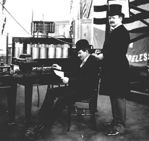 Lee DeForest (seated) sending wireless telegraph message from theLouisiana Purchase Exposition. Photograph from 1904.