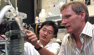 He (left) and Angenent seek to perfect a microbial fuel cell.