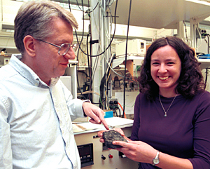 Bruce Fegley, Jr.,  Ph.D., professor of earth and planetary sciences in Arts & Sciences, and Laura Schaefer, resarch assistant in the Planetary Chemistry Laboratory, with a chunk of galena, or lead sulfite.  The researchers have determined that the feature on Venus that looks like snow is composed of both lead and bismuth sulfides, settling a long-time controversy in the planetary community.