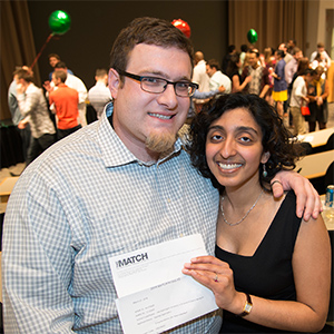 ​Washington University MD/PhD student Radhika Jagannathan (right) received two surprises at Match Day on Friday, March 21. First, she learned she will be going to NewYork-Presbyterian/Weill Cornell Medical Center for her residency. Then, moments later, she received an unexpected marriage proposal from her boyfriend, Tom Wilson.