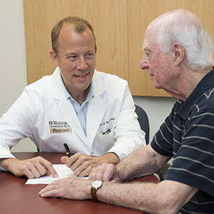 Eric J. Lenze, MD, consults with patient Daniel Viehmann. Lenze led a multicenter study that found that adding a second drug can relieve depression in many older adults whose symptoms don't resolve after treatment with a standard antidepressant drug.