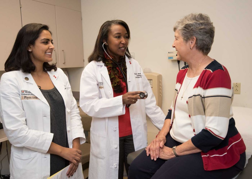 Angela L. Brown, MD, (center) runs the Hypertension Clinic at Washington University. Brown helps Karen Carriker (right) and other patients control high blood pressure. She also provides training for health-care professionals, such as cardiology fellow Nishtha Sodhi, MD (left), in how to care for patients with hypertension.
