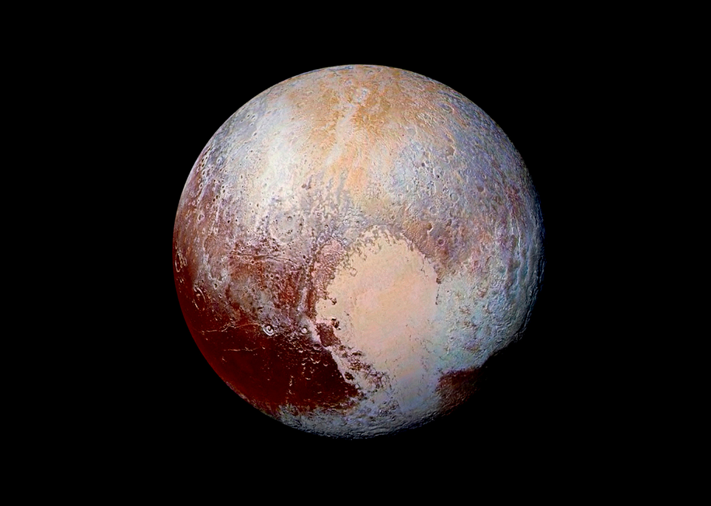Pluto’s surface sports a ­remarkable range of colors, ­enhanced in this view to a rainbow of pale blues, yellows, oranges and deep reds. (NASA/JHUAPL/SwRI)