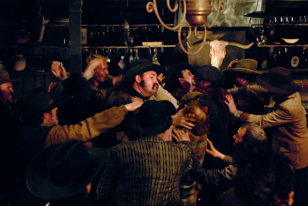 Men fighting in saloon