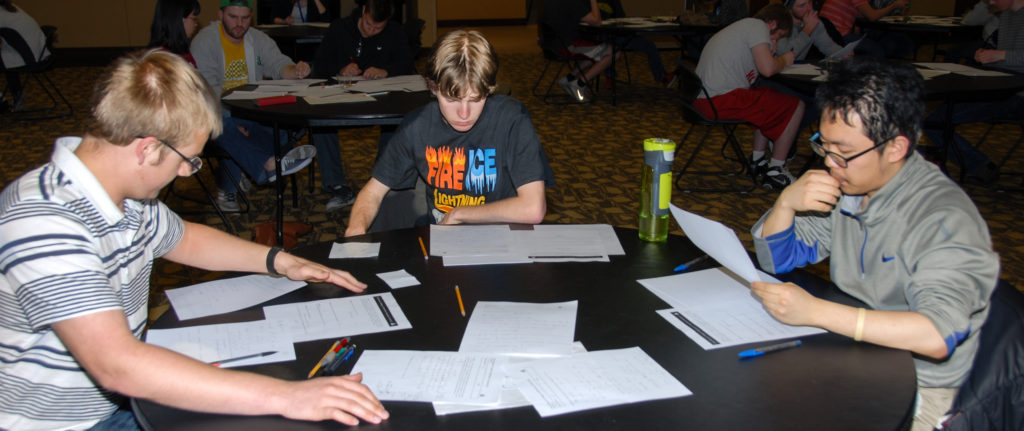  Matt Ehren, Alex Mason and Harry Go working on problems at the 21st Annual Missouri Collegiate Mathematics Competition. They scored a perfect 100 to tie with a team from Missouri Southern State for first place. (Photo: Hang Chen)