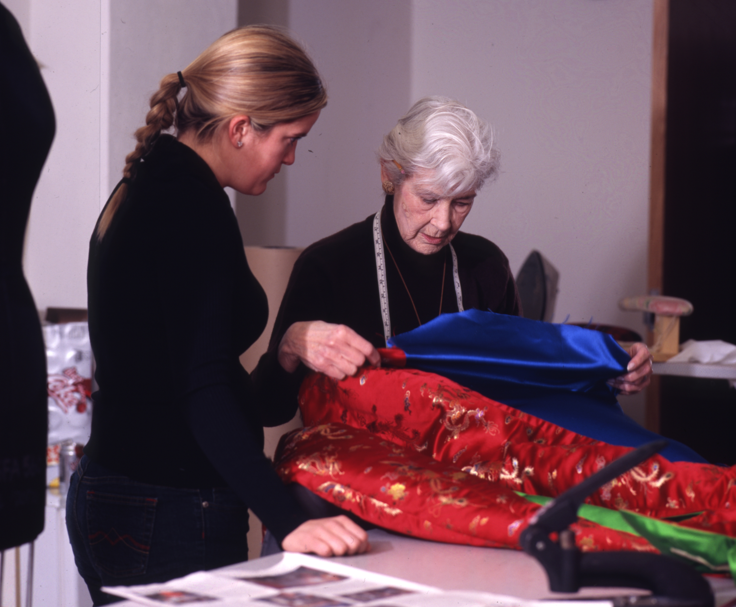 Cathy Rodgers, who taught fashion design for 47 years, works with a student in the Sam Fox School's Bixby Hall in 2004.