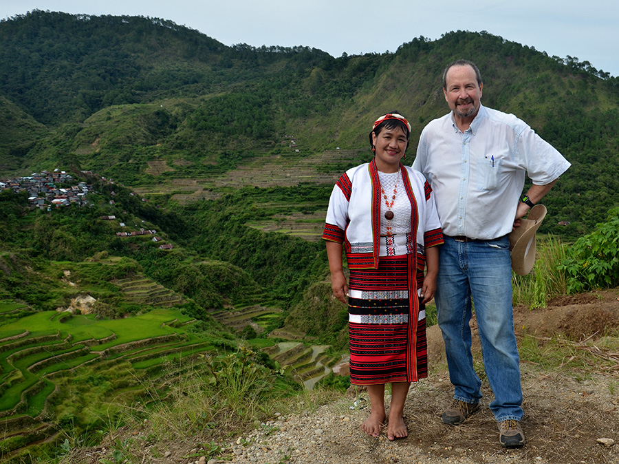 Washington University anthropologist Glenn Stone, shown here with an agricultural field agent, has studied rice cultivation and research in the Philippines since 2013. 
