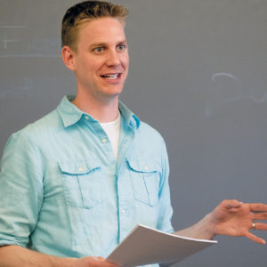 Abram Van Engen, associate professor of English and affiliated faculty member with the Danforth Center on Religion and Politics, teaches undergraduates in his course “City on a Hill: The Concept and Culture of American Exceptionalism.” (Sid Hastings/WUSTL Photos)