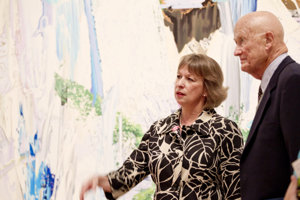James M. Kemper Jr, who died Dec. 15, discusses Corinne Wasmuht’s “Llanganuco Falls” (2008) with Sabine Eckmann, the William T. Kemper Director and chief curator of the Mildred Lane Kemper Art Museum. “I liked the Wasmuht because of the water play and the road,” said Kemper, who helped the museum acquire the painting. “As a visual work it is quite impressive and lighthearted—until you figure out what you’re really looking at.” He also appreciated its historical significance, noting that “older Germans were very skeptical of anything that had to do with outdoor life (or youth culture) because it was all associated with Hitler.” (Photo: Whitney Curtis/Mildred Lane Kemper Art Museum)