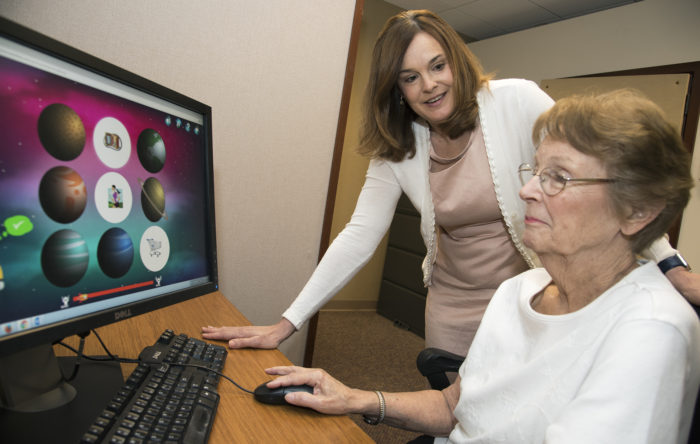 hearing loss patient works at a computer