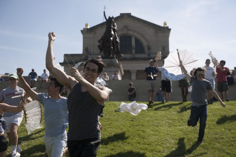 students launch kites on Art Hill