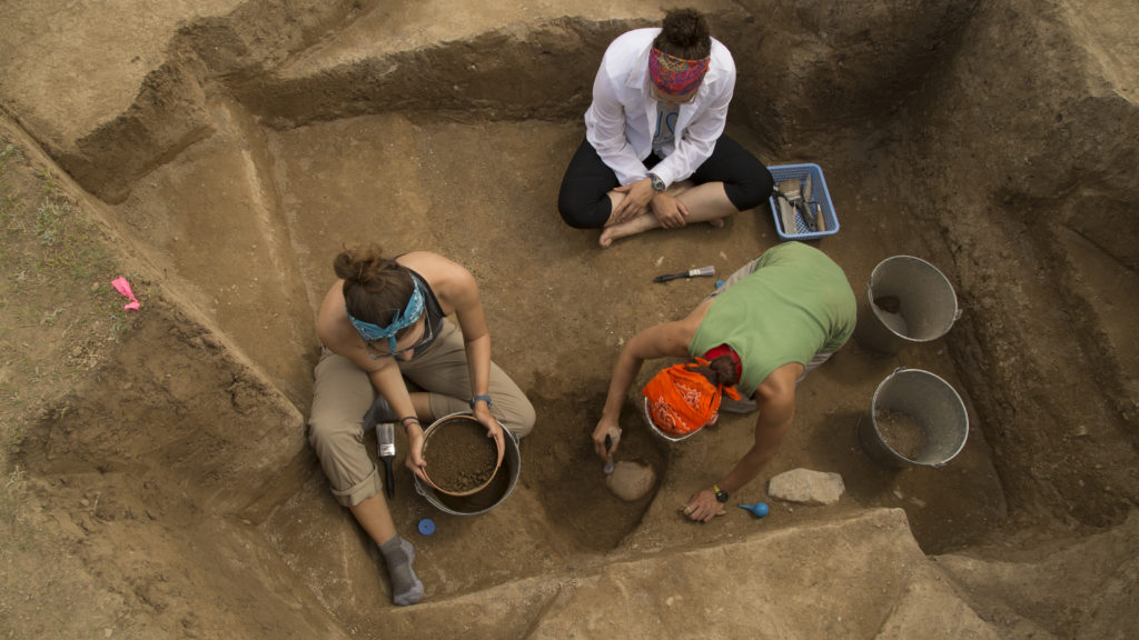 Elissa Bullion (right), MA ’14, is in the anthropology doctoral program. She and her team analyze human remains to understand the daily life of the working-class people who lived in Tashbulak. (Photo: Thomas Malkowicz)