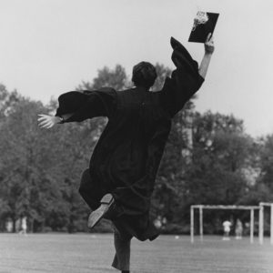 A graduate leaps for joy after Commencement 1967. (Washington University Archives)
