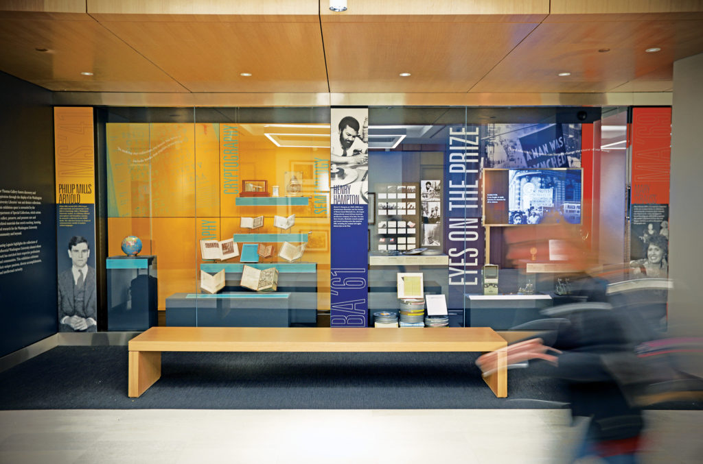 The Jack E. and Debbie T. Thomas Gallery, located along the corridor that connects the south entrance to the new north entrance, features museum-quality exhibition space and fosters discovery by displaying distinct library collections. The inaugural ­exhibit, ­“Lasting Legacies,” pays tribute to influential university alumni. (James Byard/Washington University)