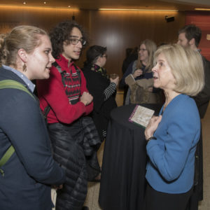 (From left) Students Viktoria Ohstrom and Sam Smith engage Elaine Pagels in a conversation during the reception following the scholar’s Assembly Series lecture. (Mary Butkus/WUSTL Photos)