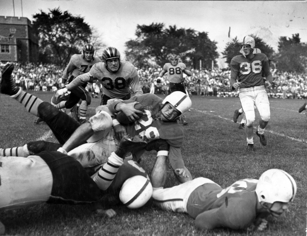 Black and white photo of football tackle