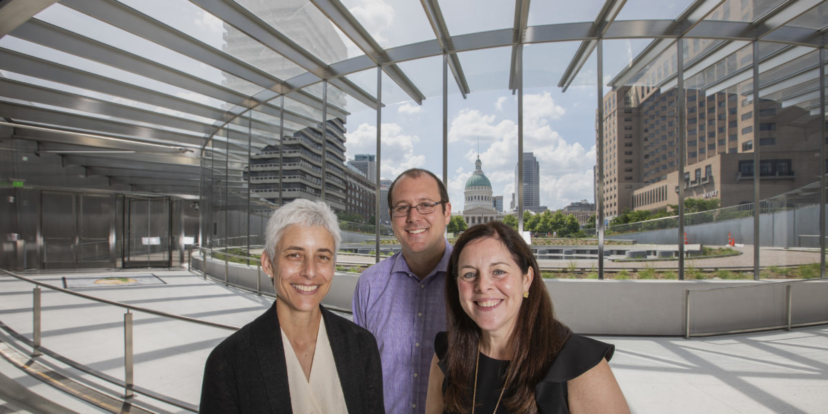 Three alumni — (from left) Anna Leavey, Eric Moraczeswski and Sarah Melinger — work for the Gateway Arch Park Foundation, which joined public and private organizations in a multi-year effort to refurbish the museum and grounds connected to the Gateway Arch. (Joe Angeles/Washington University)