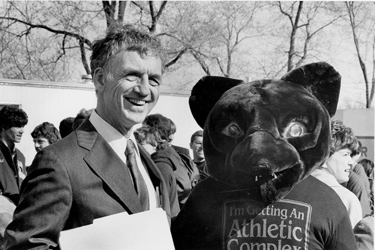 Chancellor Danforth is joined by the Washington University Bear mascot during the Athletic Complex renovation groundbreaking event in 1983.