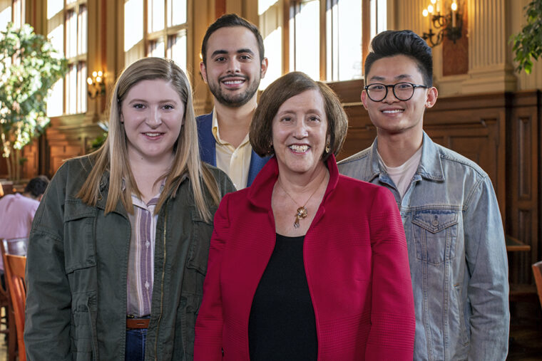 A longtime supporter of scholarships in Arts & Sciences and law, Grant (at left) is pictured in early March 2020, prior to any mask mandate, with scholarship recipients (from left) Meghan Street (Arts & Sciences), Ian Herrera (Law) and Max Xu (Arts & Sciences). (Photo: Joe Angeles/Washington University)