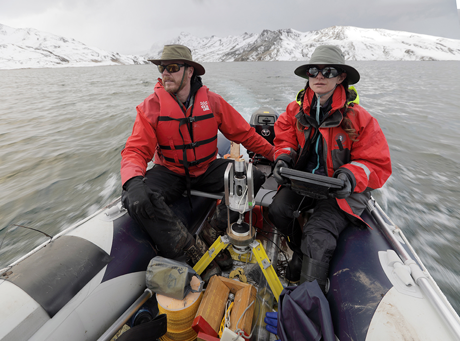 Washington University climate scientist Bronwen Konecky (right) and collaborator Preston Sowell scout sediment coring locations on Lake Sibinacocha using a boat that the research team transported from Cusco. (Photo: Tom Malkowicz)
