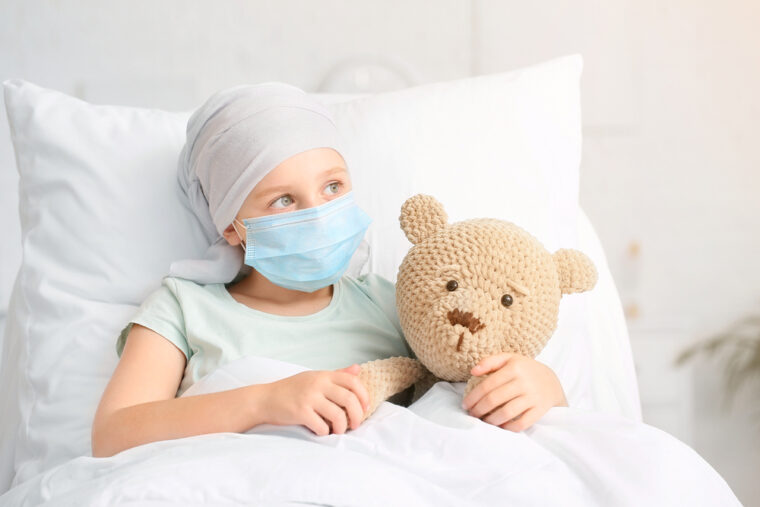 sick child holding bear