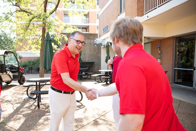 One of WashU’s most important missions is the education of our students from around the world. Each year, Chancellor Martin (center) greets undergraduate students and their families on move-in day at the South 40 residence halls. (Photo: Jenny Sinamon/Washington University)