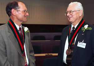 At his Sept. 9 installation as the Myron Northrop Professor of Accounting, Ronald R. King, Ph.D., (left), chats with Gaylord Northrop, Myron's nephew, at the Olin School of business' Charles F. Knight Executive Education Center.