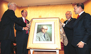 Unveiling a portrait of Uncas A. Whitaker at the Oct. 20 dedication of Uncas A. Whitaker Hall for Biomedical Engineering are (from left) William H. Danforth, chancellor emeritus and vice chairman of the Board of Trustees; David W. Kemper, vice chairman of the Board of Trustees; G. Burtt Holmes, chair of The Whitaker Foundation; and Chancellor Mark S. Wrighton.