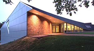 Adrian Luchini's design of the 18,000 square-foot addition/renovation of Chesterfield Montessori School (above) earned him an AIA/St. Louis Architecture Merit Award. The long, low-slung shingled roof has been likened to a great, swooping bird. Like many of Luchini's works, the Montessori project avoids hard lines and boxy, rectangular shapes and employs open areas bound by subtle, softly undulating curves.