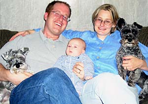 Rob Wild, wife Angie and son Jack relax at home with the family dogs, Morgan (left) and Bailey.