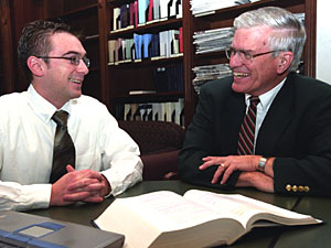 Charles R. McManis, J.D. (right), the Thomas and Karole Green Professor of Law, discusses international intellectual property law with first-year student Jeremy Zangara. McManis 