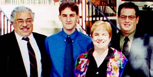 Neil White with his wife, Ann, and sons, Michael (far right) and Justin. Neil White with his wife, Ann, and sons, Michael (far right) and Justin.