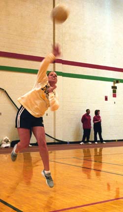 Jessie Groff of the Student Financial Services volleyball team shows off the form that helped her team win the volleyball crown on Staff Day.