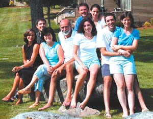 Rosario Hernandez (third from left) and her husband, Arthur H. Neufeld (fourth from left), are surrounded by children Sebastian, with wife Christine (left); Nicolas, with wife Monica (rear); Erica; and Russell, with wife Jessica (right).