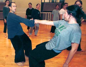 Choreographer David Dorfman works with a graduate student during a 2001 master class. Dorfman, Donald McKayle and Trinette Singleton will host adjudication concerts in conjunction with the American College Dance Festival Association's Central Region Festival.