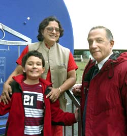 Ramanath Cowsik, his wife, Sudha, and son Aditya enjoy a visit to the St. Louis Science Center's Planetarium. Another son, Siddhartha, works for Microsoft in Seattle.