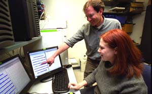 Erik D. Herzog, Ph.D., assistant professor of biology in Arts & Sciences, and graduate student Sara Aton examine brain activity data on the computer in Herzog's Monsanto Hall laboratory. The two have discovered a very important role that a peptide called VIP plays in coordinating daily rhythms in our brain's biological clock.