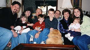 Ben Sandler (fourth from left) with family members (from left) son-in-law Tom Brown, granddaughter Megan Brown, daughter Jenny Brown, grandson Trey Brown (on Sandler's lap), grandson Zach Brown, son David Sandler, wife Louise Sandler, daughter-in-law Brittney Sandler, granddaughter Carrie Sandler and George the dog.