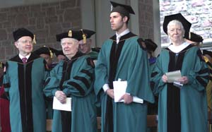 From left: Honorary degree recipients Robert G. Roeder, Ph.D., the Arnold O. and Mabel S. Beckman Professor of Biochemistry and head of the Laboratory of Biochemistry and Molecular Biology at Rockefeller University, and William H. Gass, Ph.D., the David May Distinguished University Professor Emeritus in the Humanities in Arts & Sciences at WUSTL, stand next to Jordan Friedman, senior class president and student Commencement speaker, and honorary grand marshal Lee N. Robins, Ph.D., professor emeritus of sociology in psychiatry in the School of Medicine.