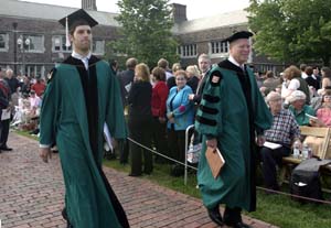 Senior class president and student Commencement speaker Jordan Friedman walks with Richard A. Gephardt, former U.S. House minority leader who delivered the Commencement address. Gephardt also received an honorary doctor of humane letters during the ceremony.