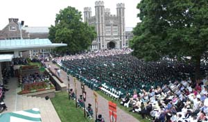 Students, their families and friends crowd Brookings Quadrangle for Washington University's 144th Commencement. More than 2,500 academic degrees were conferred in the ceremony.