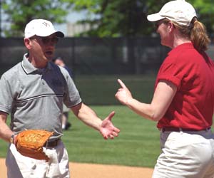 At the softball tourney, Chancellor Mark S. Wrighton hams it up as he playfully 