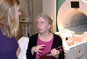 Deanna Barch (right), a WUSTL psychology researcher, is co-author of a study that used the functional magnetic resonance imaging machine to monitor brain activity as people with schizophrenia performed a series of memory-related tasks.