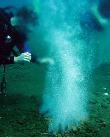 Jan Amend sampling shallow marine vent fluids in 2005 at Ambitle Island, Papua, New Guinea.