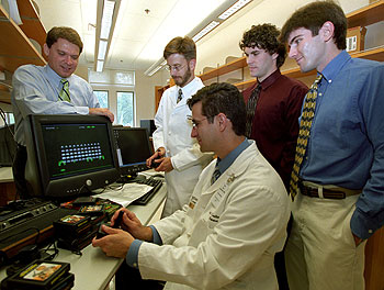 This team, from left, Daniel Moran, Matthew Smyth, Eric Leuthardt, Nick Anderson and Tim Blakely, enabled a 14-year-old to play a two-dimensional video game using signals from his brain.