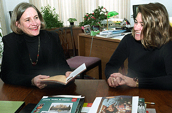Priscilla Stone, Ph.D. (left), director of Overseas and Undergraduate Programs for International and Area Studies, chats in her office with assistant Toni Loomis. 