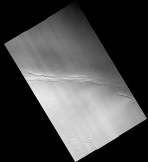 This full-frame image from the High Resolution Imaging Science Experiment camera on NASA's Mars Reconnaissance Orbiter shows faults and pits in Mars' north polar residual cap that have not been previously recognized.